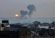 ISIS Terror STRIKES Taliban’s Safe Zone Flames and smoke billowing over a cityscape.