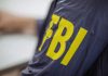Jacket with FBI letters in yellow.