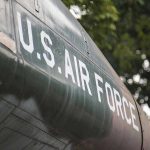 Ancient Bomber Gets HYPERSONIC Weapons U.S. Air Force plane with trees in background.