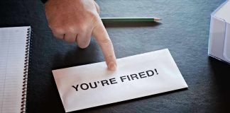 Envelope with YOURE FIRED and pointing finger.