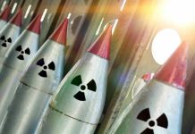 Pentagon Spent MILLIONS on Mystery Weapon Line of nuclear missiles with radiation hazard signs.