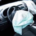 Deployed airbags in cars interior.