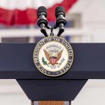 Unprecedented VP Visit Shocks Armenia Vice Presidential podium with microphones and emblem.