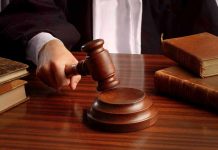 Warrant Lies Triggered Death—Judge Says Otherwise Judges gavel on desk with books.