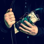 Pipe Bomb Pardon Loophole STUNS White House Person holding a homemade explosive device.