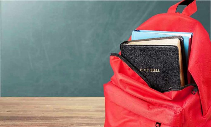 Red backpack with a Bible and books inside.