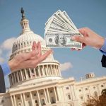 Hands exchanging money in front of Capitol building.