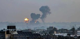 Trump Ultimatum COLLIDES With Israel’s Shocking Strike Flames and smoke billowing over a cityscape.