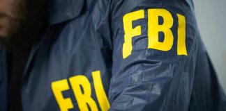 FBI Boss Drops Sleeper-Cell Warning FBI jacket with yellow letters.