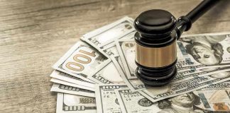 FBI Raid: Pro-Life Dad Scores $1M Victory Gavel on a pile of hundred-dollar bills.
