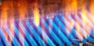 Close-up of blue flames from a gas burner