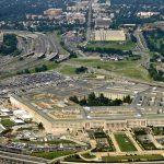 Aerial view of the Pentagon surrounded by highways and urban areas