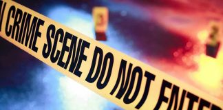 Crime scene tape with do not enter text.