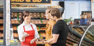 Supermarkets SNEAKILY Spying On You While You Shop! A grocery store employee assisting a couple with their shopping