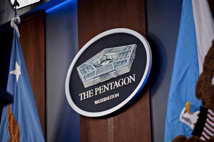The Pentagon emblem between two flags.