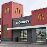 Car PLOWS Through McDonald’s – Driver Immediately Flees! McDonalds restaurant exterior with logo and drive-thru sign.