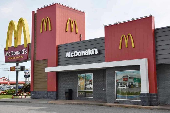 711932764 McDonalds restaurant exterior with logo and drive-thru sign.