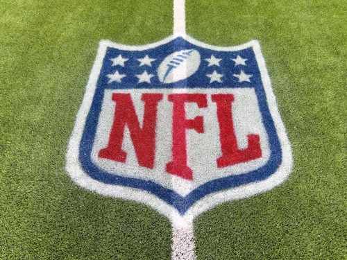 NFL logo painted on a football field