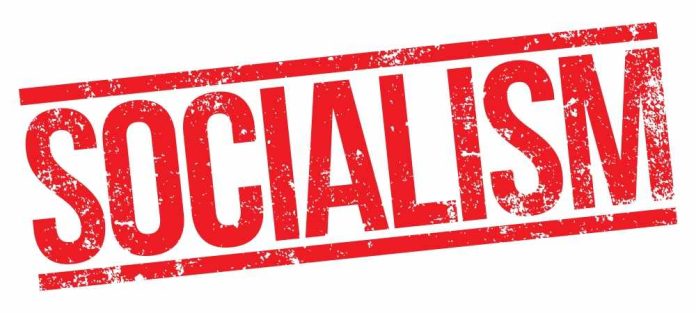 shutterstock_1112363120 Bold red text reading 'SOCIALISM' on a white background