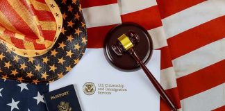 Trump Uses Unknown Law for the First Time Ever U.S. passport, gavel, and USCIS document on American flag