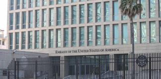 U.S. Consulate GUNNED DOWN In Attack Embassy building behind tall black security fence