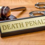 Rappers Sentenced To DEATH For Doing THIS Gavel, handcuffs, and a nameplate reading death penalty on a wooden desk