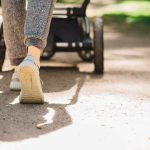 Homeless Maniac Launches VICIOUS Stroller Attack! Person walking with a stroller on a sunlit path