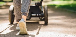 Homeless Maniac Launches VICIOUS Stroller Attack! Person walking with a stroller on a sunlit path