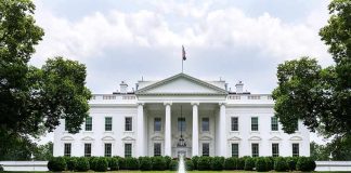 China Buys Headquarters Steps-From-White-House The White House with fountain and red flower bed