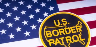 U.S. Border Patrol emblem on American flag