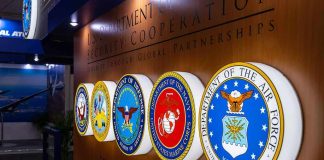 Military department seals displayed on a wall