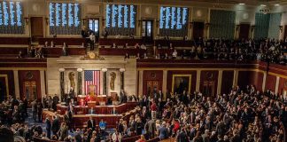 House chamber filled with lawmakers during a session
