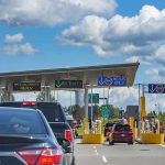 US Citizens Ordered to Seek Shelter And Avoid Govt Buildings Amid Chaos Vehicles queue at a border crossing checkpoint