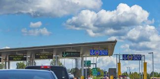 Vehicles queue at a border crossing checkpoint