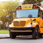 Yellow school bus with stop sign extended