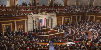 Midnight Senate Vote Secures AG Nominee Legislative chamber filled with attendees during a formal address