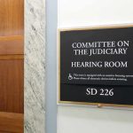 Committee on the Judiciary hearing room sign on wall