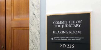 Committee on the Judiciary hearing room sign on wall