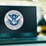 All D.C Flights GROUNDED After This Happened! Laptop displaying U.S. Department of Homeland Security logo.