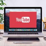 Woke Judge Rules AI Child Porn At Home LEGAL YouTube logo on a laptop screen on desk.