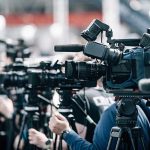 Kimmel Makes DISGUSTING McConnell Joke During Monologue Broadcast cameras on tripods at a press event
