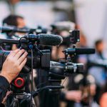 Video cameras on tripods at a media event