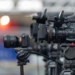 Professional video cameras on tripods