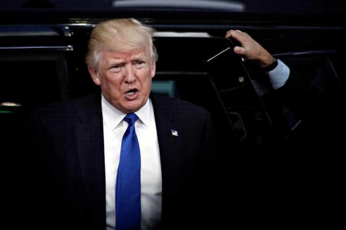 shutterstock_1045903501 Donald Trump stepping out of a vehicle in a suit and blue tie