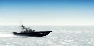 Police patrol boat speeding across open water
