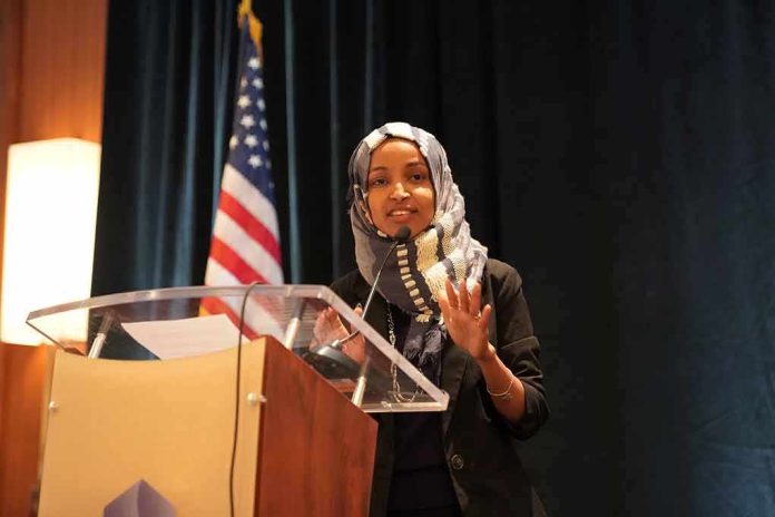 Woman in hijab speaking at a podium