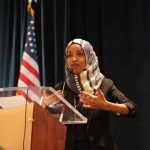 Ilhan Omar’s ‘Un-American’ Bill Targeting ICE Goes Viral Ilhan Omar speaking at a podium with a microphone