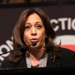 Kamala Clip Goes Viral – Sparks Drunk Wine Mom Memes woman speaking at a podium with microphone