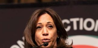 Kamala Clip Goes Viral – Sparks Drunk Wine Mom Memes woman speaking at a podium with microphone