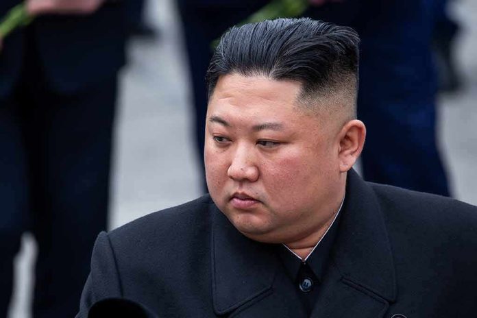 Kim Jong-Un looking to the side in a dark overcoat